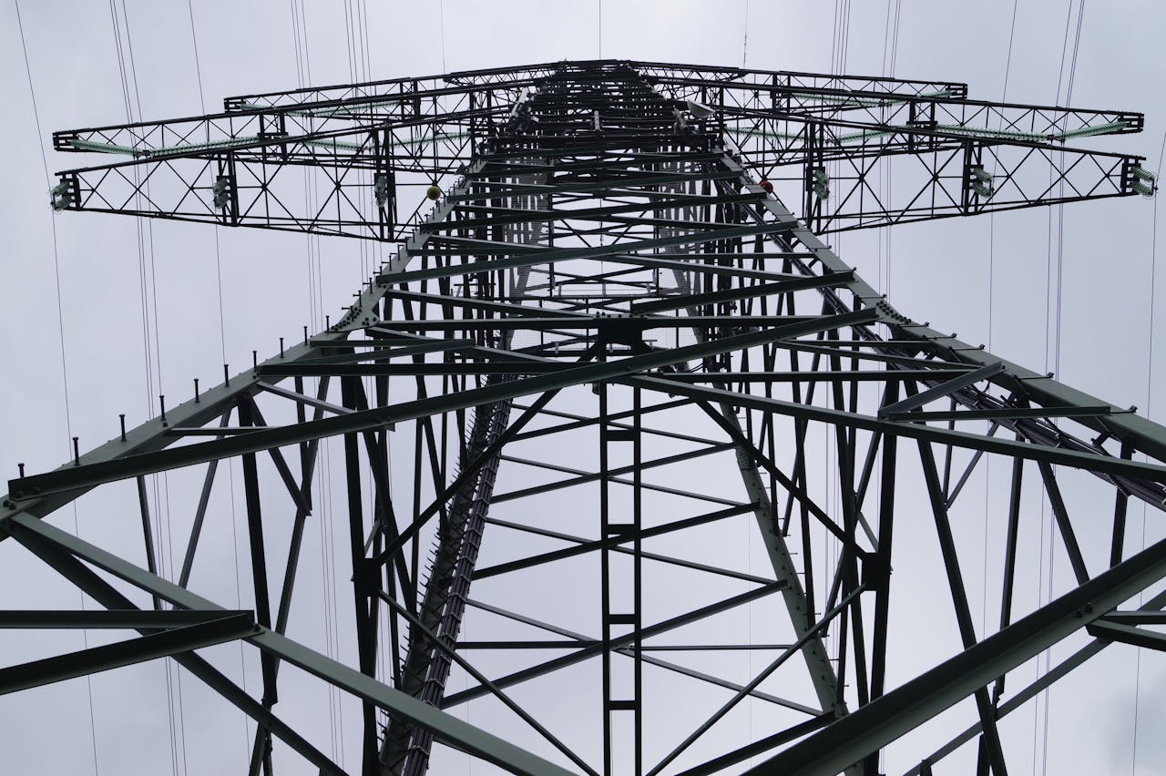 Crafting Captivating Headlines: Your awesome post title goes here Close-up low angle view of a metal electricity pylon against a cloudy sky.